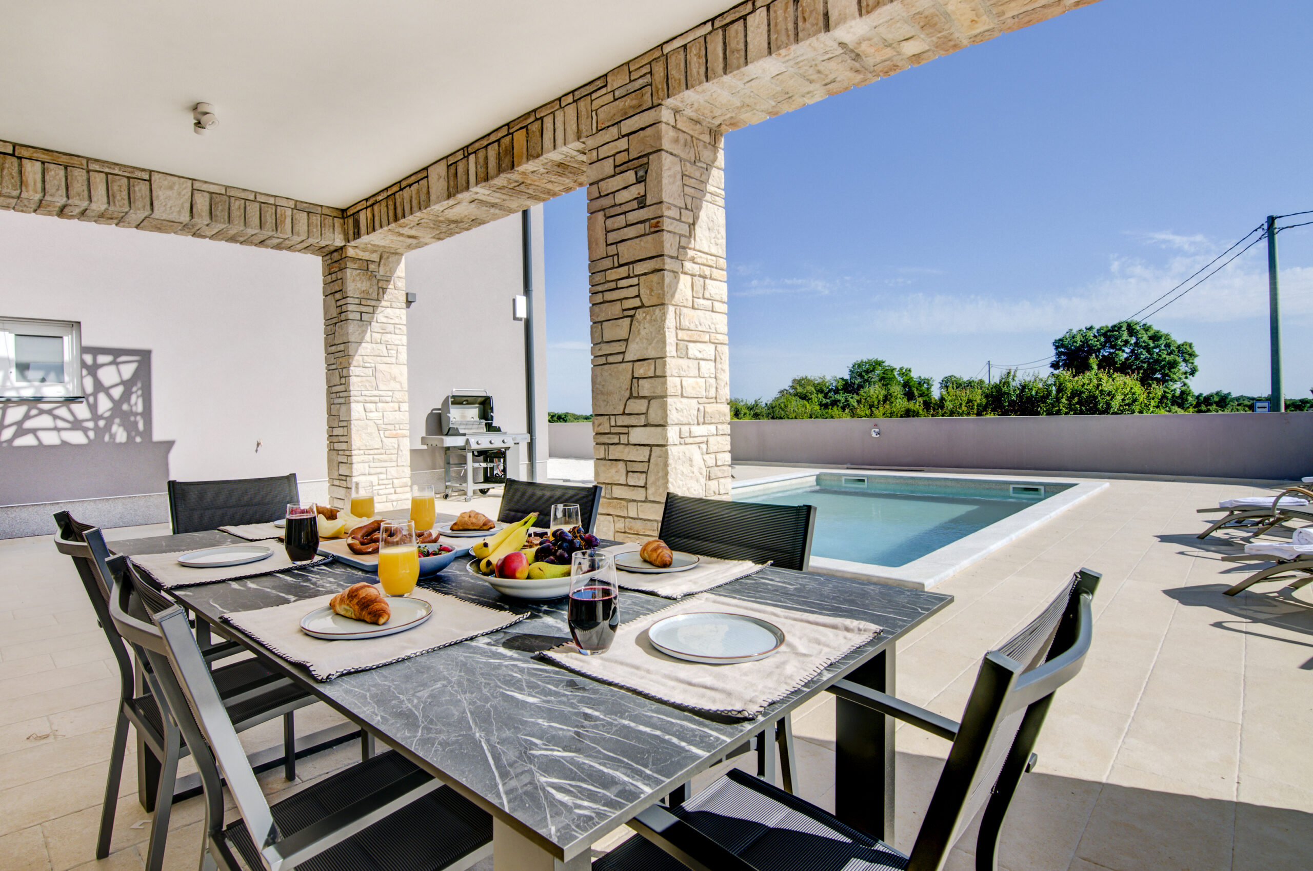 Outdoor dining area by the pool